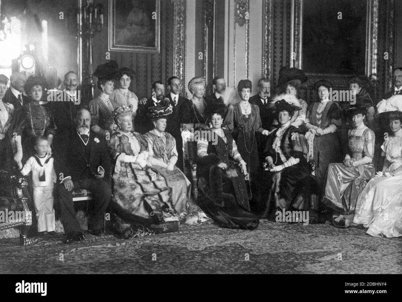 Group picture of the English royal family with international royal guests at Windsor Castle, in Wales in 1907. Bottom row from left: Prince Olaf of Norway, King Edward VII of Great Britain, Infanta Isabella of Spain, Princess Beatrice of Battenberg, Grand Duchess Maria of Russia, Queen Amelie of Portugal, Duchess Helene of Aosta, Princess Maria Immaculata of Saxony. Second row: Duchess Louise of Fife, Duke Arthur of Connaught, Queen Maud of Norway, Emperor Wilhelm II, Mary Princess of Wales (later Queen Mary of England), Princess Patricia of Connaught, George Prince of Wales (later George V), Stock Photo