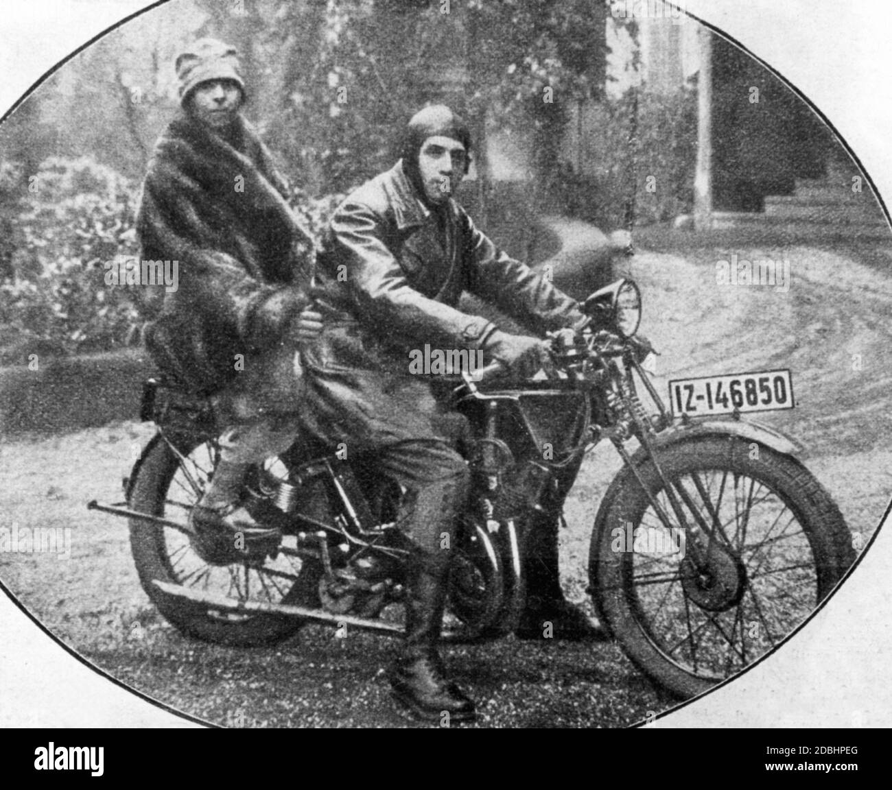 Viktoria (born of Prussia, then Princess of Schaumburg-Lippe and in second marriage Zoubkoff) sits on a motorcycle with her husband, the Russian emigrant Alexander Zoubkoff. The couple was only married for a few months and lived in Bonn. The license plate number of the motorcycle starts with I Z, which stands for the Rhine province, which belonged to Prussia. Stock Photo