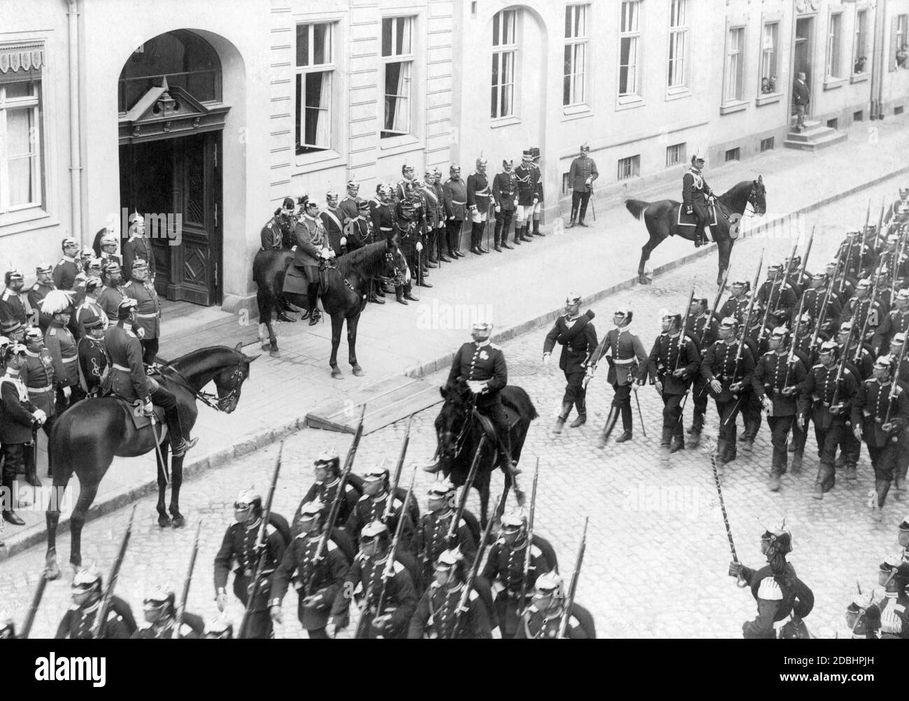 Parade of the First Guard Regiment on 2 May 1899 in front of Emperor Wilhelm II in Potsdam's Mammonstrasse. The Emperor is in front of the Officers' Mess of the regiment. Stock Photo