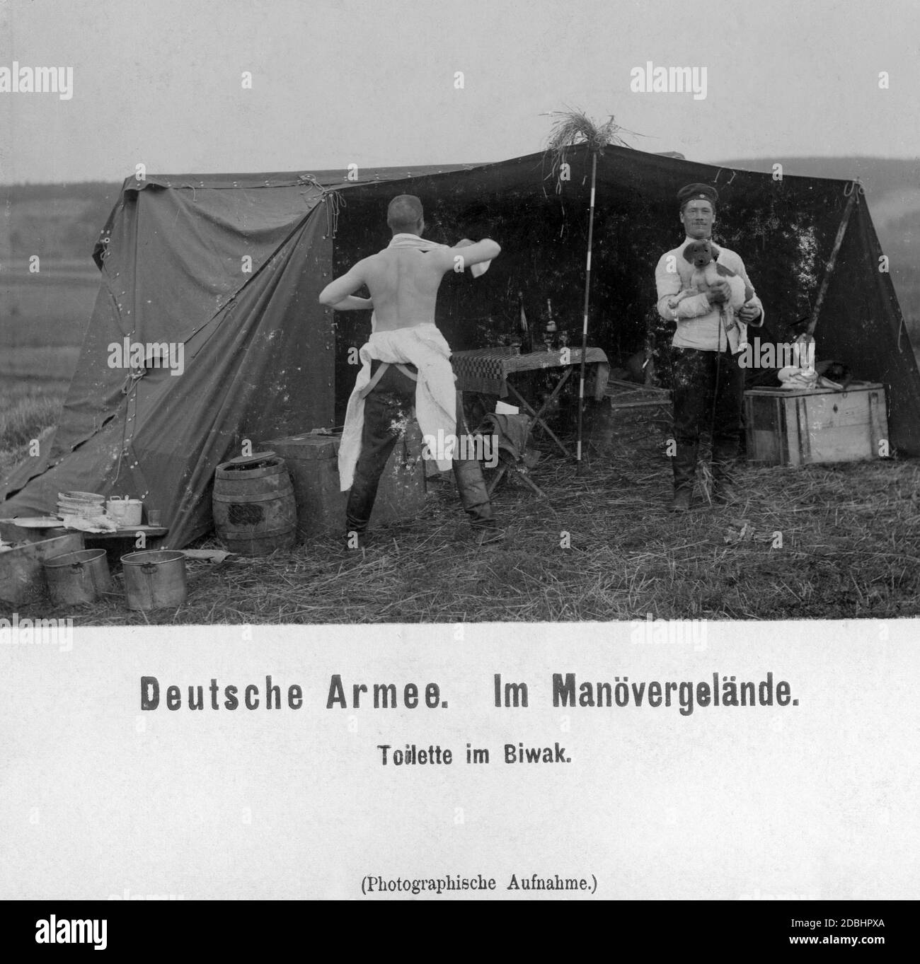'An officer in the exercise area while grooming himself in the bivouac. The picture was taken during the 1903 Kaisermanoever (''imperial manoeuvre'') in Zelthain.' Stock Photo