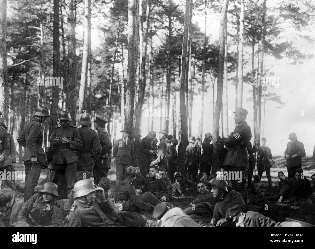Field exercise of the Freikorps with Gerhard Rossbach in the surroundings of Munich. Standing on the right and wearing a swastika armband: Gerhard Rossbach. The Freikorps took part in the Beer Hall Putsch in Munich in November 1923. Stock Photo
