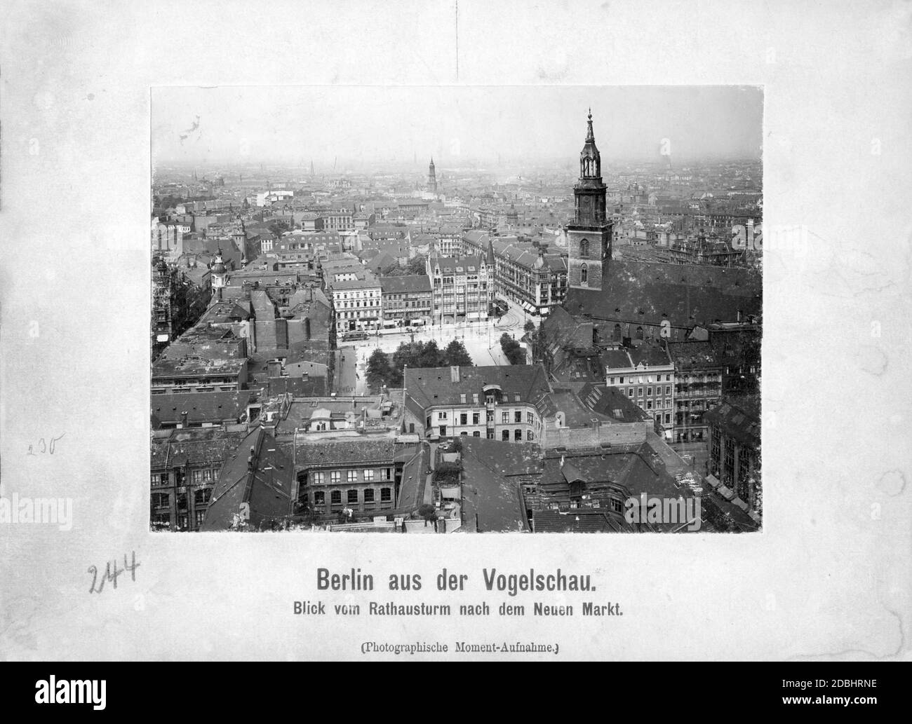 View from the tower of the Rotes Rathaus (Red City Hall) in Berlin to the Neuer Markt with the St. Marienkirche in 1908. In the background is the Sophienkirche. At the lower edge of the picture two people are standing on a roof terrace. Stock Photo