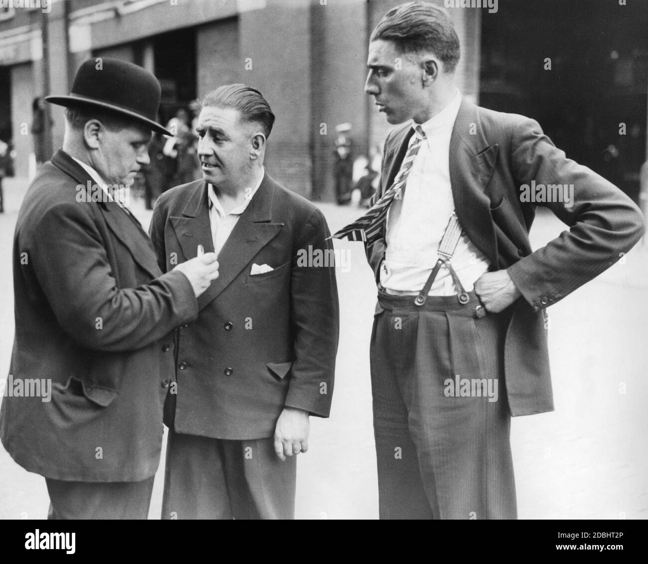 More than a thousand public transport workers in London went on strike in response to the dismissal of two employees. One of the dismissed and later rehired workers is C.R. Umney (right), here talking to colleagues. Stock Photo