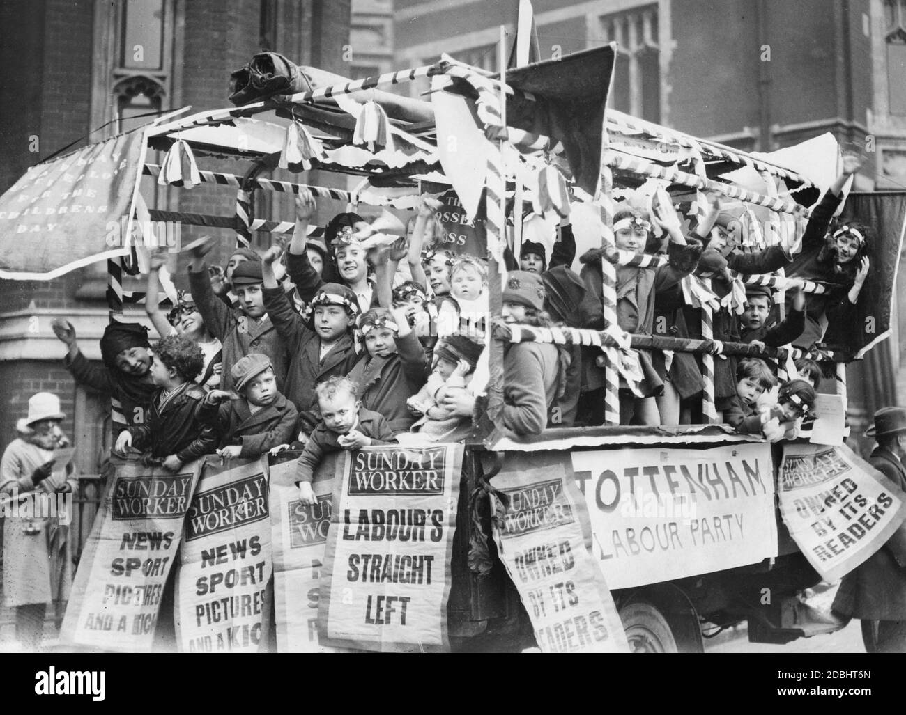 'Children sit in a ceremonially decorated float in London during the ''Labour Day'' demonstrations.' Stock Photo