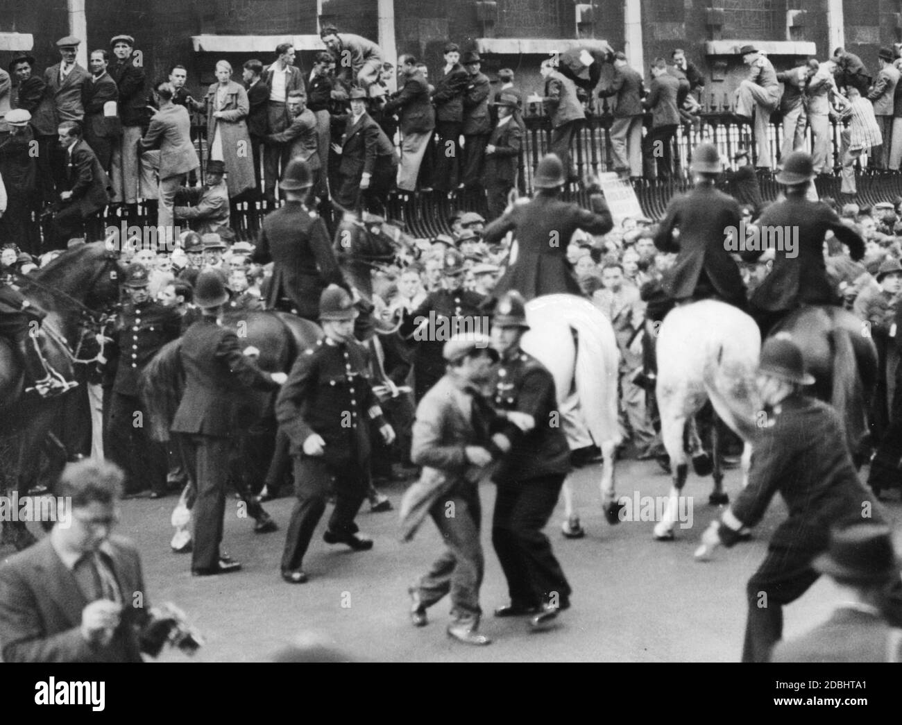 "Clashes between demonstrators and police in London. On the occasion of a planned march of the ""British Union of Fascists"" (BUF) numerous counter-demonstrators gathered in London." Stock Photo
