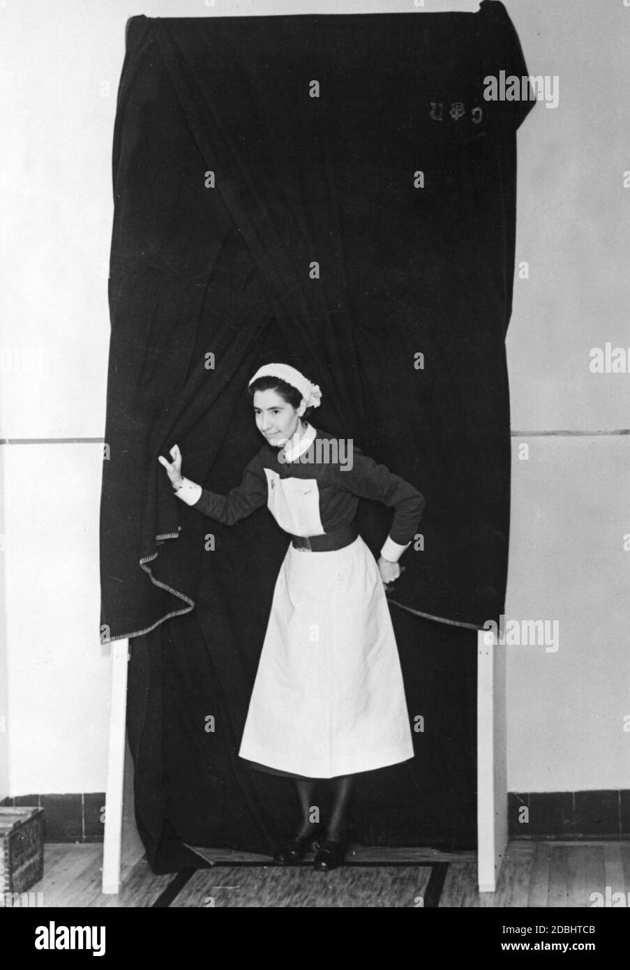 A nurse leaves a section of Westminster Hospital which is isolated from poison gas, through a lock. (Undated photo) Stock Photo