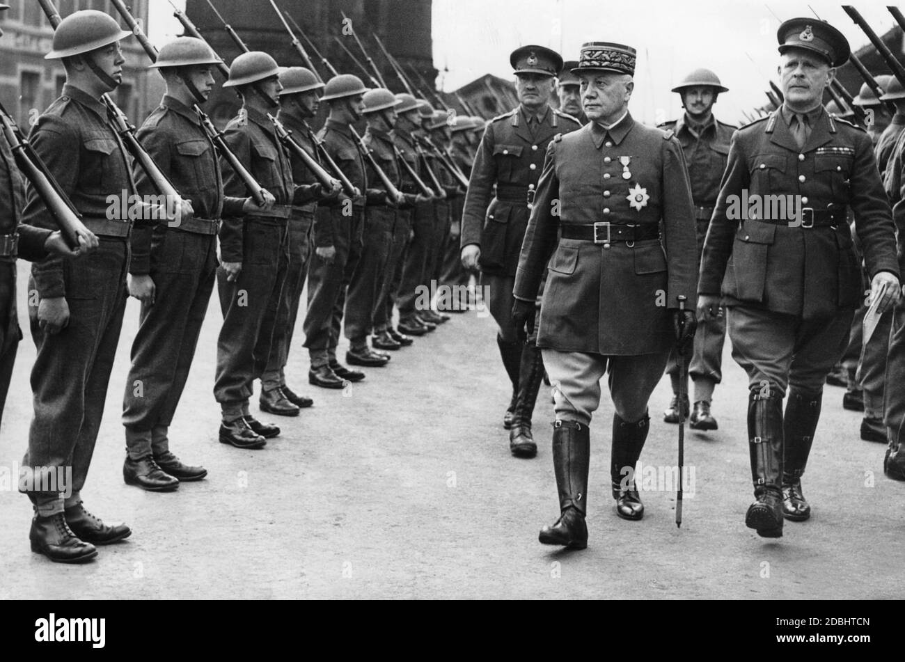 The French General Alphonse Georges (left) and  John Vereker (right), 6th Viscount Gort and Commander-in-Chief of the British Expeditionary Force (BEF), visit the Royal Inniskilling Fusiliers, an Irish infantry regiment of the British Army. Stock Photo