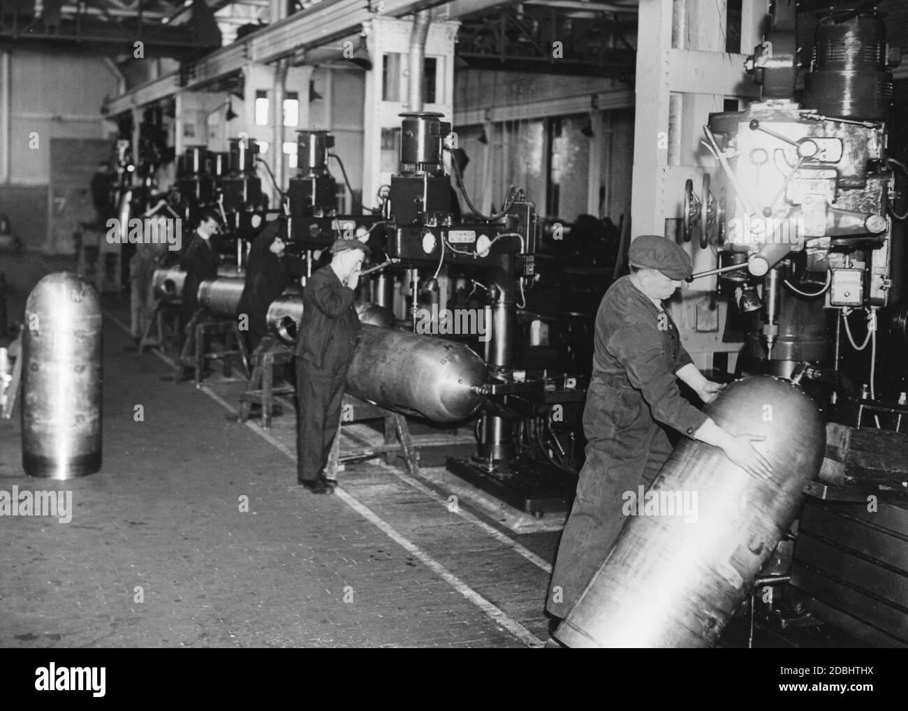 Production of torpedoes for the Royal Navy in an armaments factory in England. Stock Photo