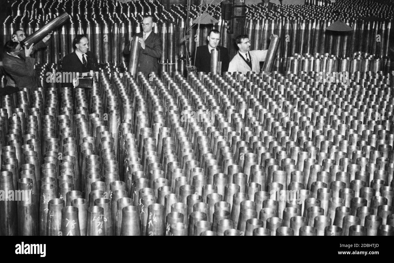 Inspection of ammunition in an English armaments factory. Stock Photo