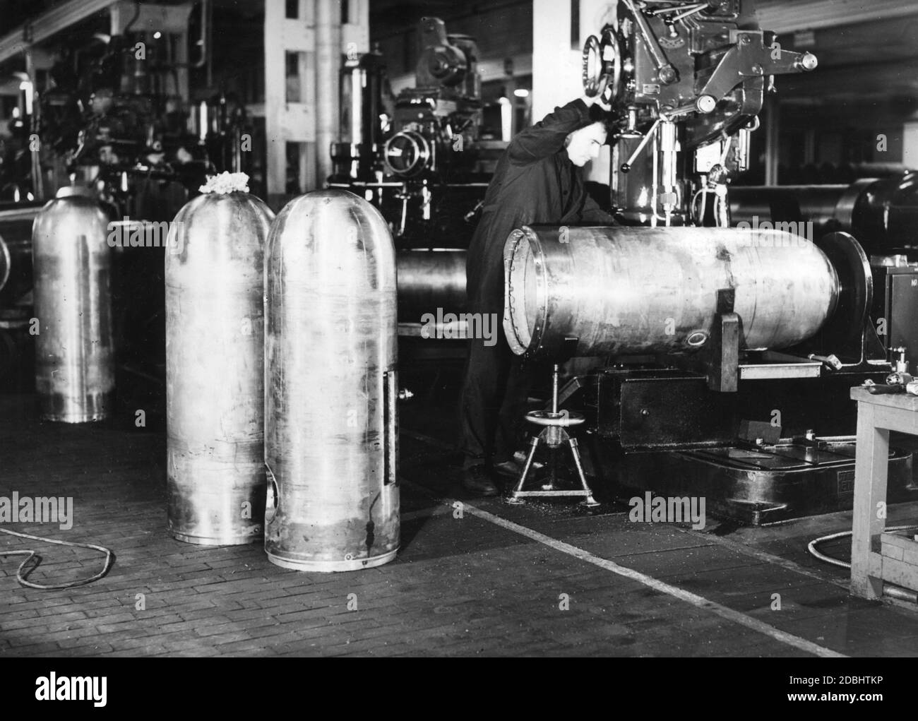 Production of torpedoes for the Royal Navy in an armament factory in England. Stock Photo
