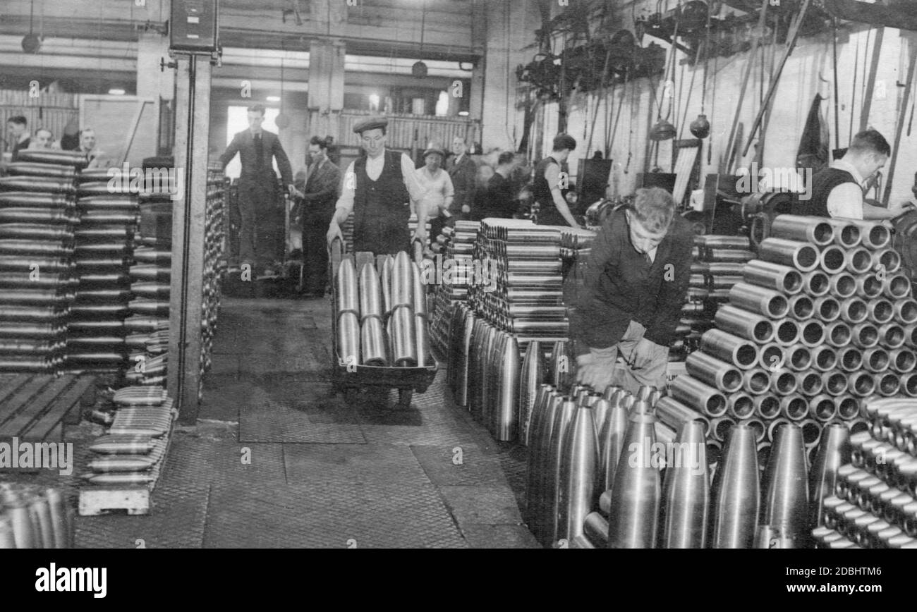 Workers involved in the production and storage of ammunition in an English armament factory. Stock Photo