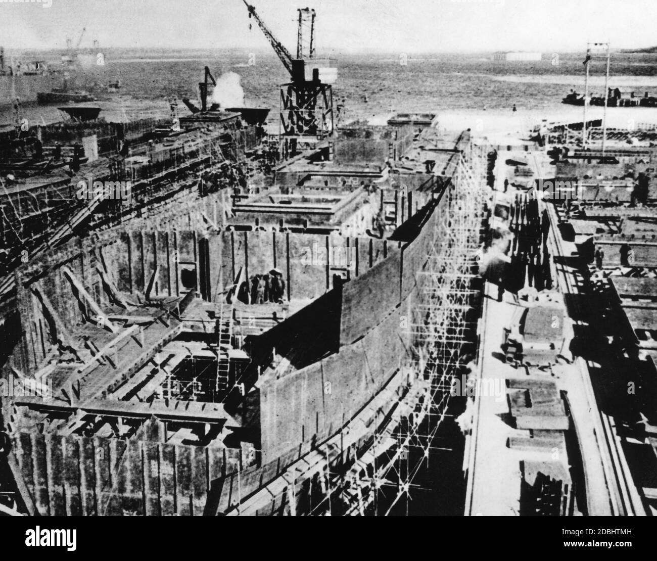 Construction of a ship in dry dock in an English shipyard. Stock Photo