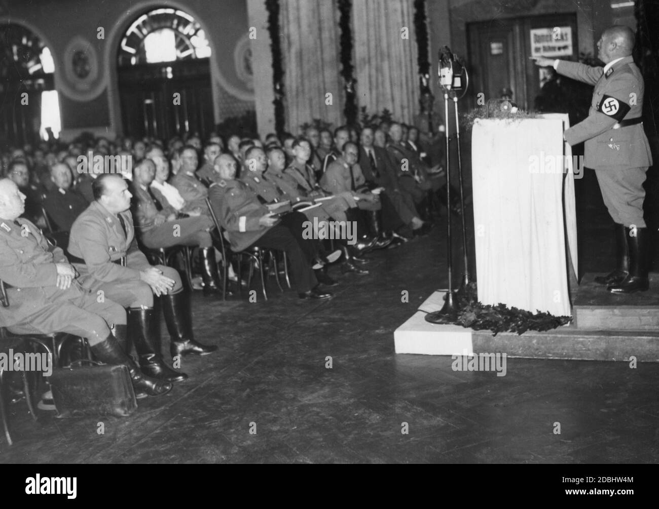 Gauleiter Julius Streicher gives a speech at the conference of the Reichsrechtsamt (Reich Justice Office) of the NSDAP and the Bund Nationalsozialistischer Deutscher Juristen (National Socialist Association of Legal Professionals) in the Nuremberg Kulturvereinshaus. In the front row, 2nd from left, Hans Frank, next to him is probably Walter Raeke. Stock Photo