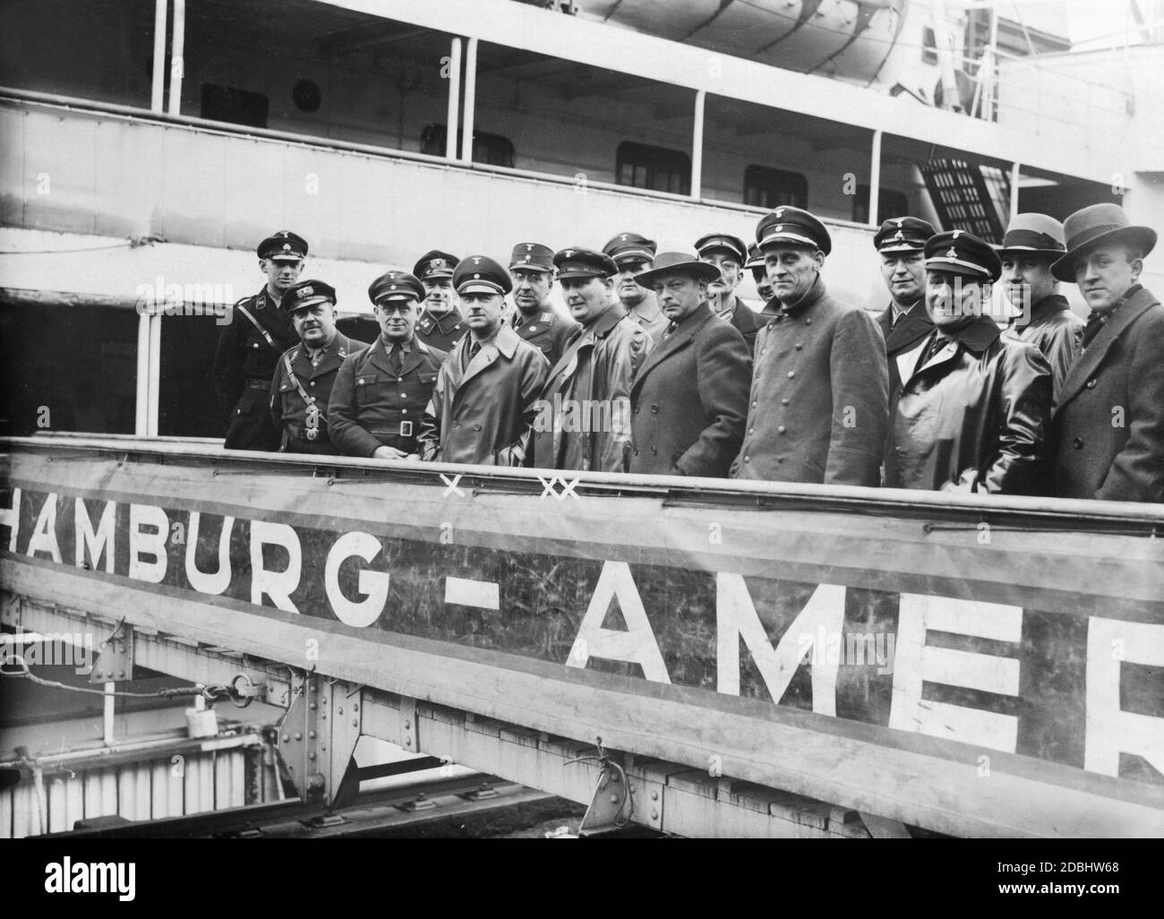 'State Councillor Walter Schuhmann (X) and State Councillor Rudolf Habedank (XX) while visiting the Hapag motor ship ''Orincco'' in the Port of Hamburg.' Stock Photo