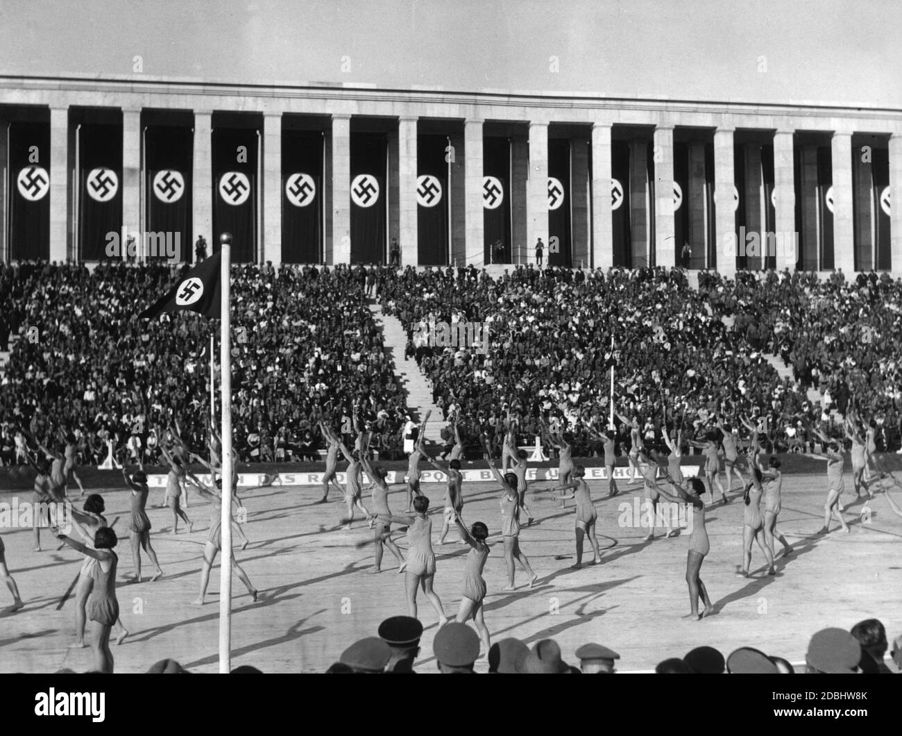 A gymnastics group presents their skills on the Zeppelin Field on the occasion of the folk festival during the Nazi Party Congress. Stock Photo