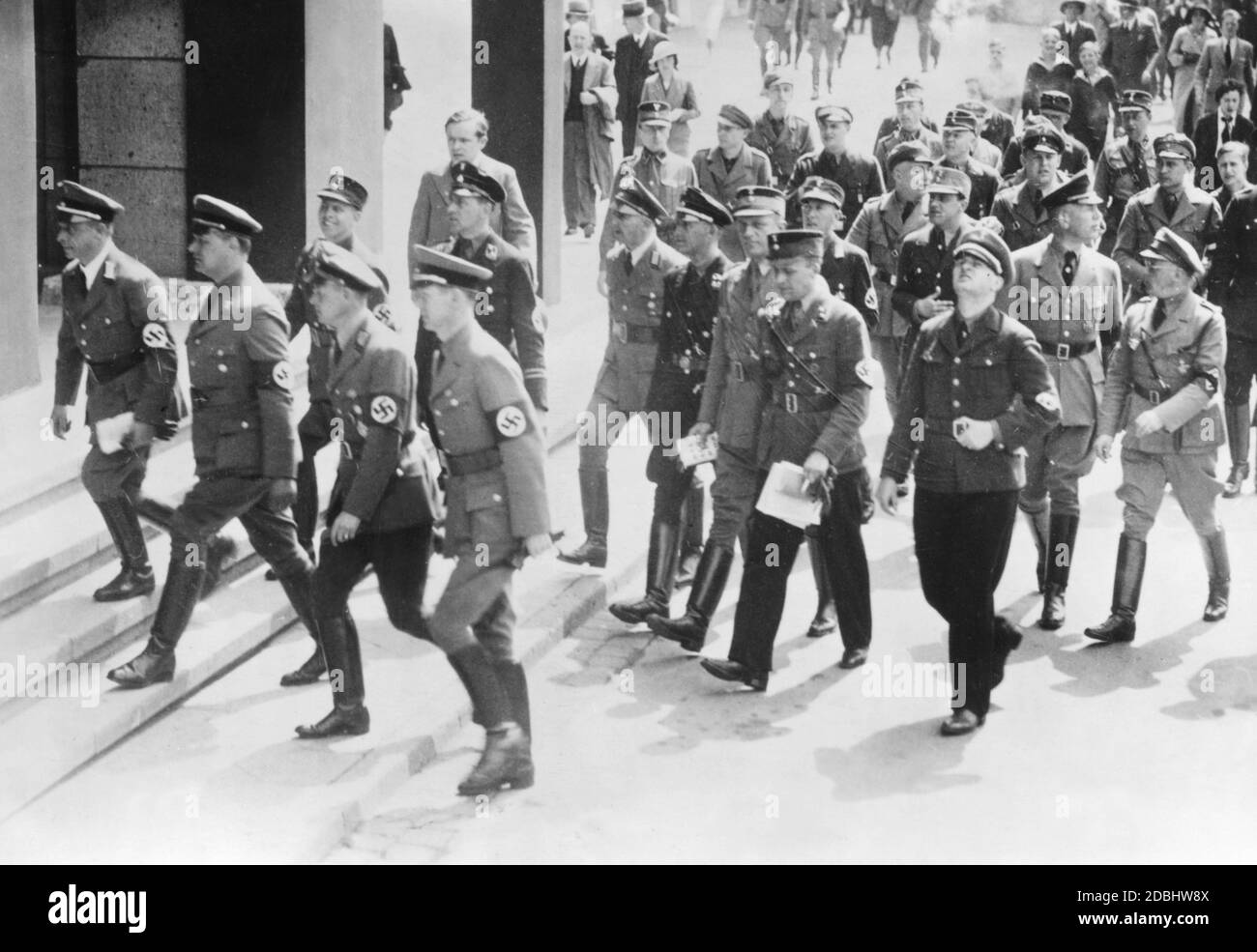'The exhibition on the German Revolution ''Der Kampf der N.S.D.A.P.'' (''The Fight of the N.S.D.A.P.'') is to be opened by Reichsleiter Alfred Rosenberg in the Duesseldorf exhibition halls. Rosenberg (2nd from left) and other party officials on the way to the opening.' Stock Photo