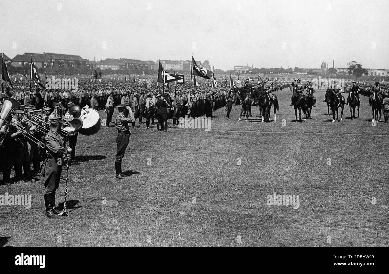 During an SA march on the Tempelhofer Feld in Berlin, Chief of Staff Roehm inspects the troops. Stock Photo