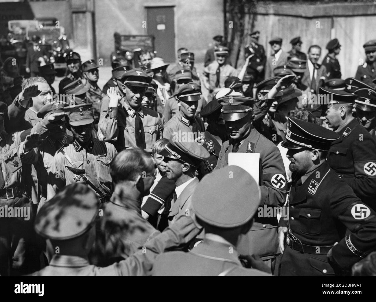 Josef Goebbels arrives at the Sportpalast. Behind him Staatsrat Goerlitzer. Party officials and members of the SA and SS are greeting him. Stock Photo