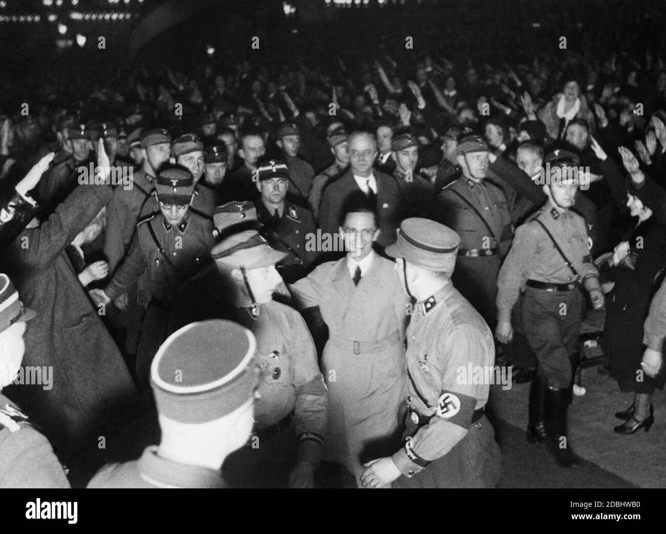 At a rally in the Sportpalast Berlin, Gauleiter of Greater Berlin, Goebbels, is accompanied by a guard of honour. Stock Photo