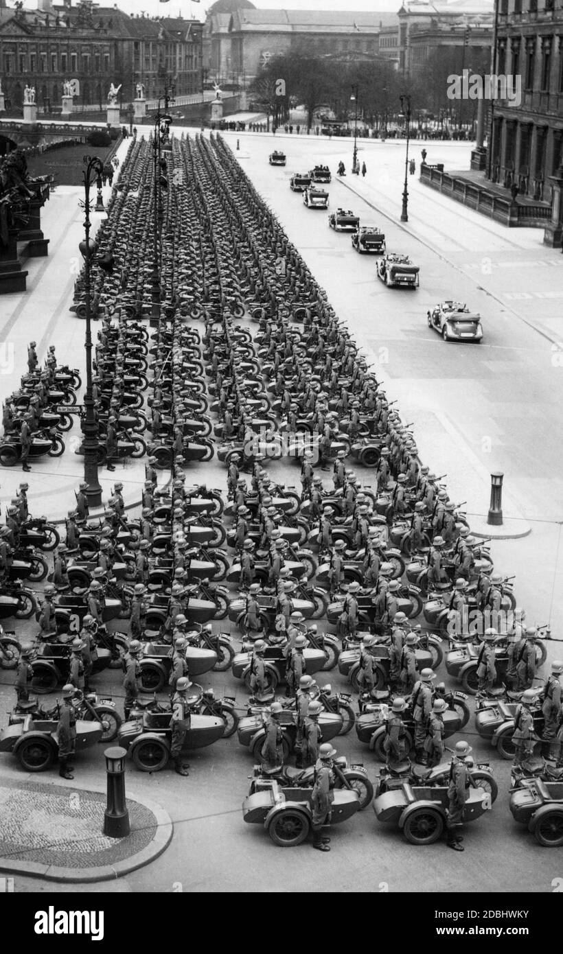 Before his birthday parade, Adolf Hitler inspects the Kraftradschuetzen (motorcycle infantry). They are standing in front of the Berlin Palace. This is his 47th birthday. Stock Photo