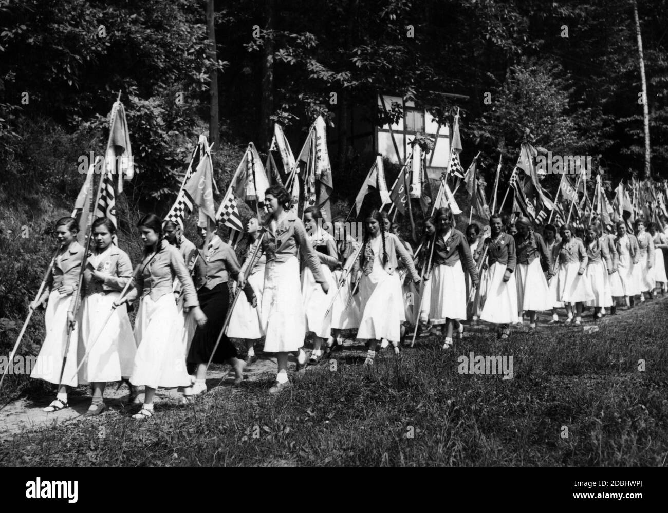 A group of girls marches with their VDA flags to the Hour of Youth on the Weisshaus sports field in Trier. Stock Photo