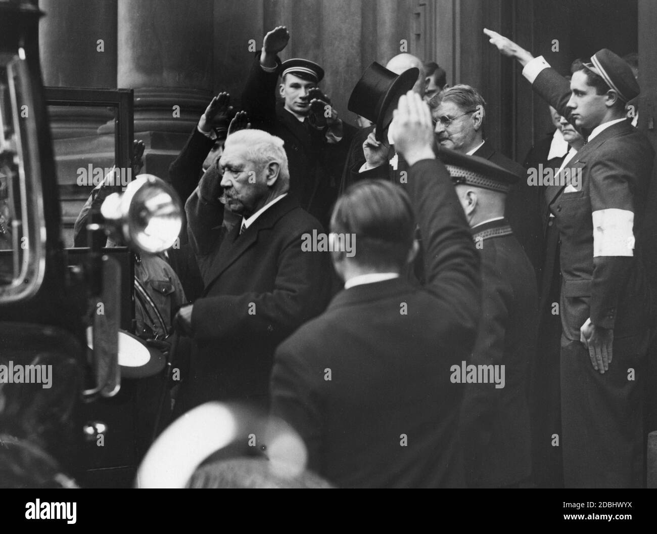 Reich President Paul von Hindenburg leaves the Dreifaltigkeitskirche (Mauerstrasse, Berlin) after the festive service and rally of the Protestant students. Behind him with hat, Secretary of State Otto Meissner. Stock Photo