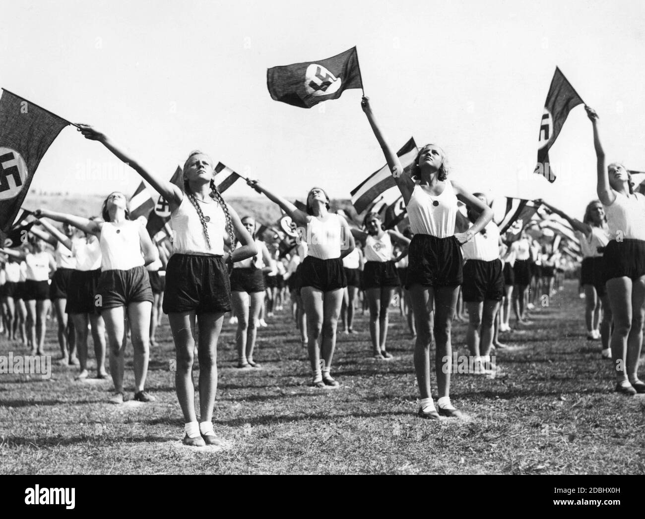 'Flag wavers from Berlin schools rehearse in the SCC-Stadion for their performance on the ''Tag des deutschen Volkstums'' (Day of German Nationality) (16.09.1934), the festival of the German school.' Stock Photo