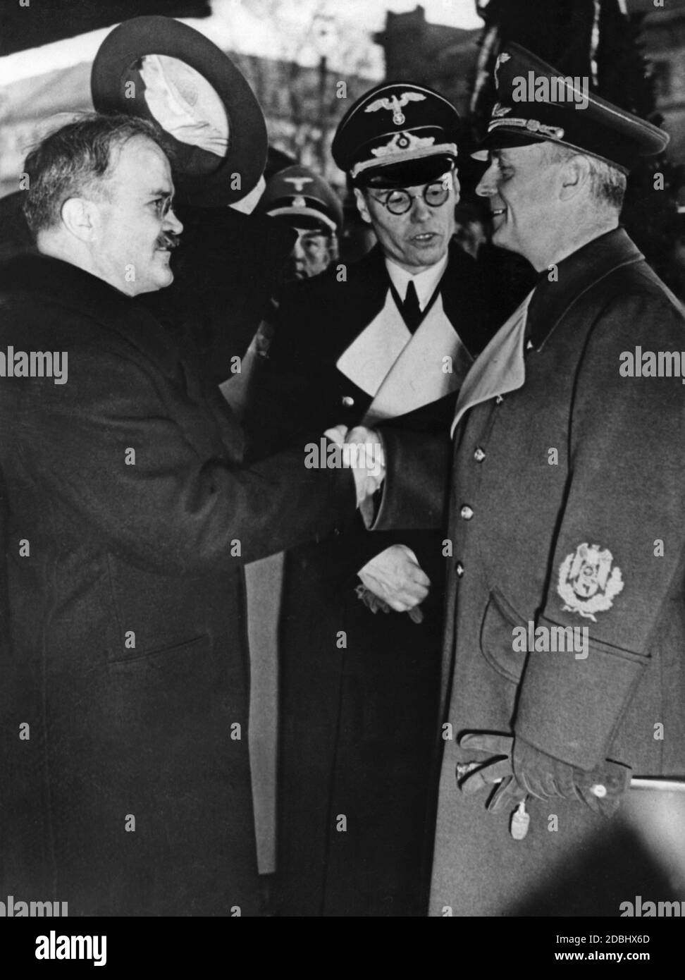 Vyacheslav Molotov bids farewell to Joachim von Ribbentrop at the Anhalter Bahnhof in Berlin. Between them is the interpreter. Stock Photo