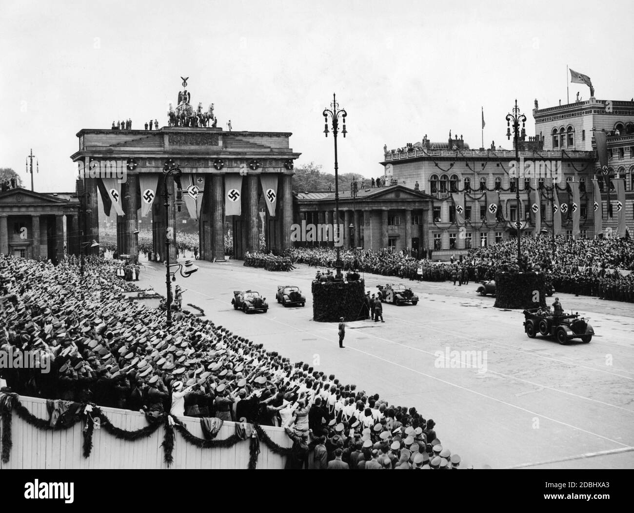 Victory parade of the Wehrmacht in Berlin after the end of the fighting in France. Before Joseph Goebbels' speech on Pariser Platz: the staff of the marching division with its vehicles on Pariser Platz. On the left are Joseph Goebbels and the commander of the Reserve Army, Friedrich Fromm. Stock Photo
