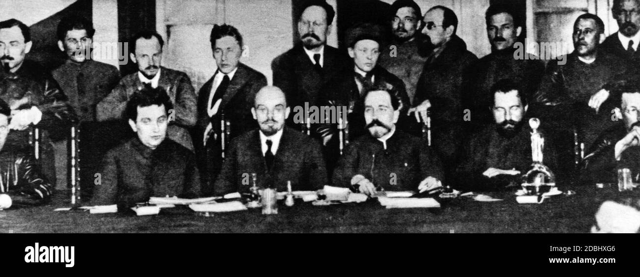 Sitting from left: Zinoviev, Lenin, Rykov. Standing from left: Bucharin, Stalin. 2nd from right: Kamenev. Zinoviev was the first president of the Comintern and was succeeded by Bukharin. All the above-mentioned, with the exception of Lenin, were later sacrificed to Stalin's purges. Stock Photo