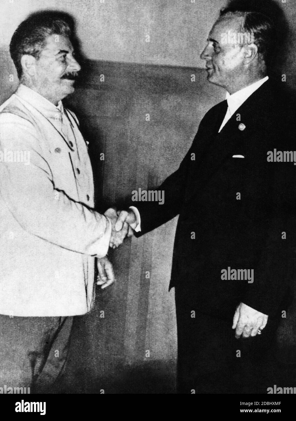 Joseph W. Stalin and Joachim Ribbentrop after the signing of the German-Soviet Nonaggression Pact. In a secret additional protocol, the two powers divided Poland and the Baltic countries among themselves. Stock Photo