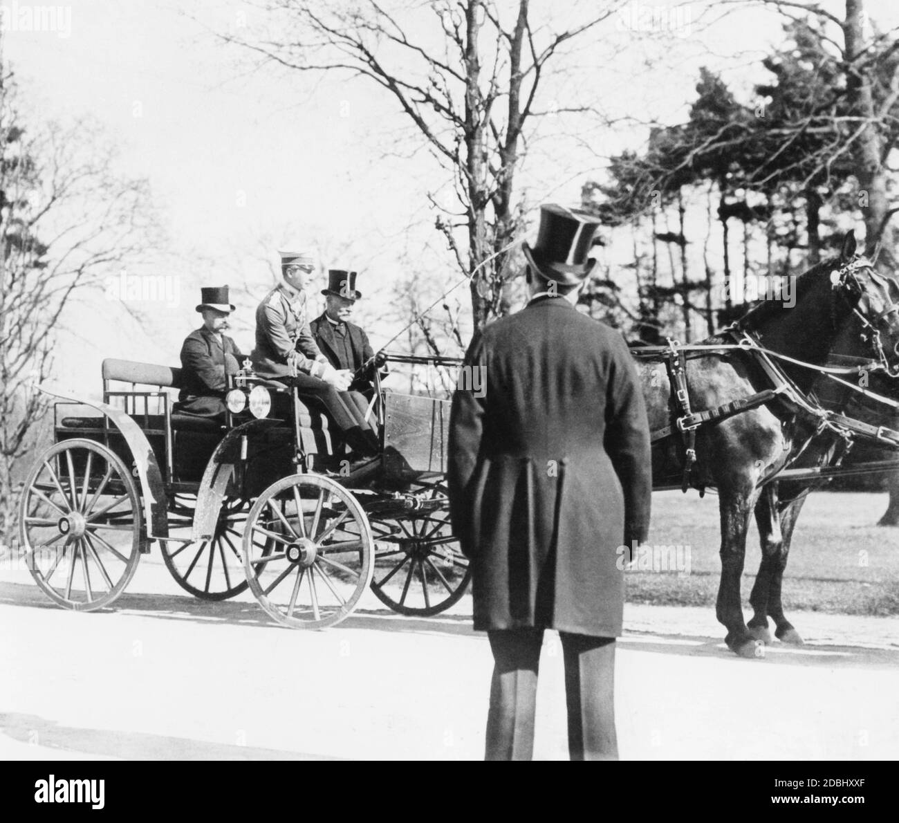 The German Crown Prince Wilhelm in a new carriage. Major von Rohr, sitting next to him, instructs him in the use of the reins. Stock Photo