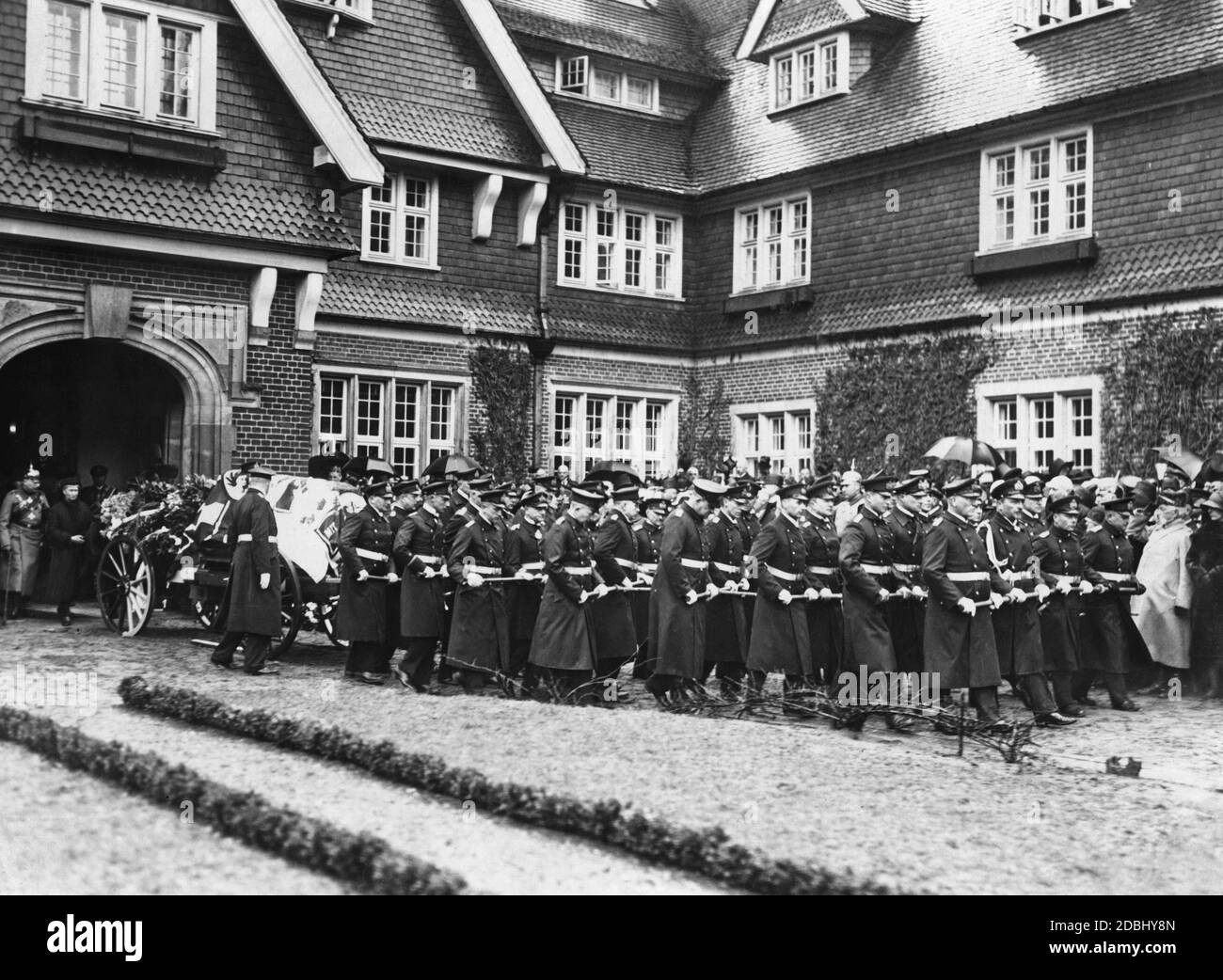 The funeral of Prince Henry of Prussia took place on April 24, 1929. He was buried in a mausoleum on his estate Hemmelmark. In the picture the coffin is pulled on the gun carriage by 32 naval officers. Behind the wagon walks the widow Irene of Prussia (born of Hesse-Darmstadt) on the left of the picture. Stock Photo