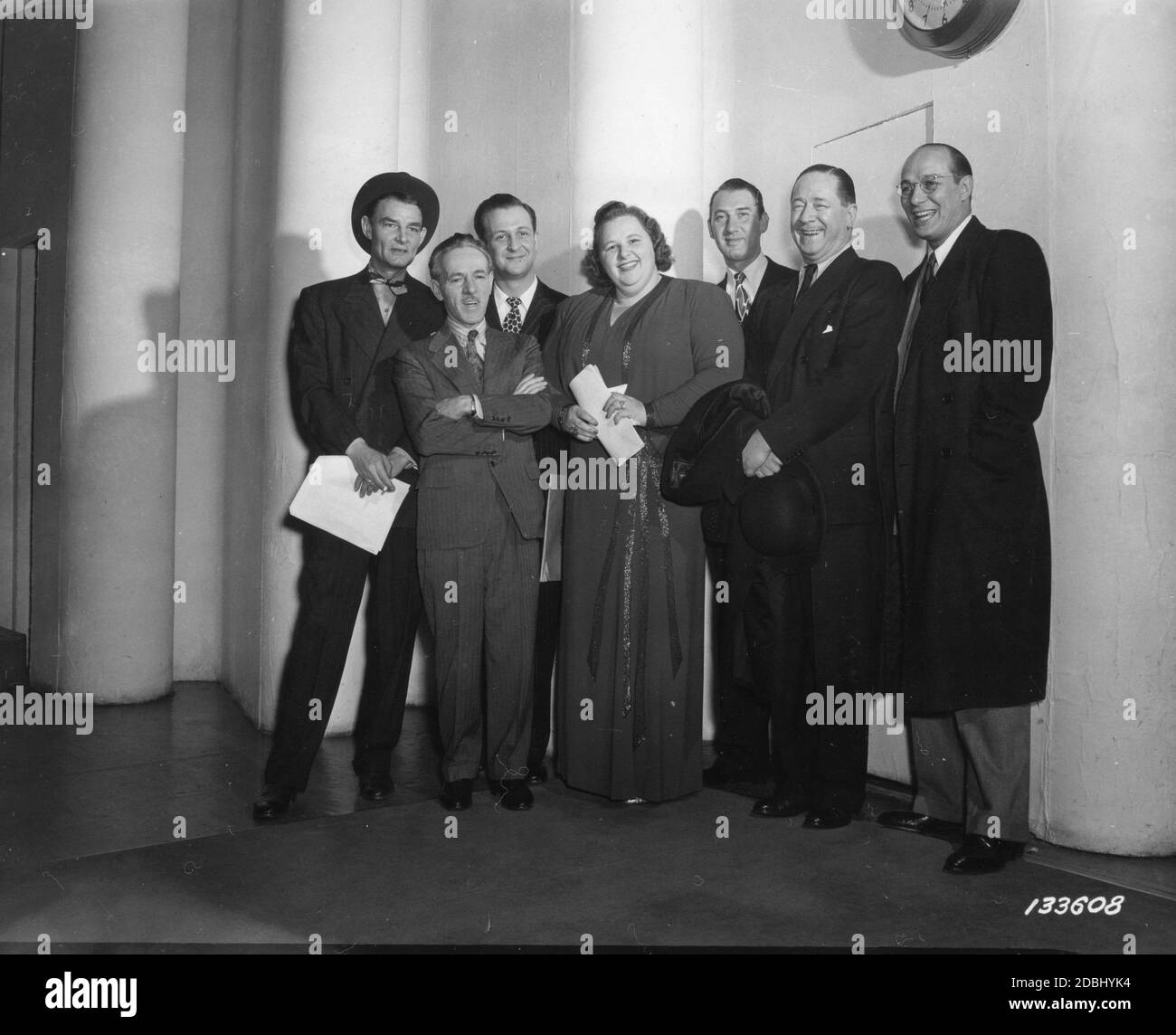 The cast of 'Command Performance USA,' the War Department radio program headed by Kate Smith (1907-1986), as they leave CBS Playhouse #2. (L-r): Announcer Ed Gerdner, Barry Wood, Miss Smith, Henry (Henny) Youngman, Robert Benchley and Ted Husing, New York, NY, 3/13/1942. (Photo by US Army Signal Corps/RBM Vintage Images) Stock Photo