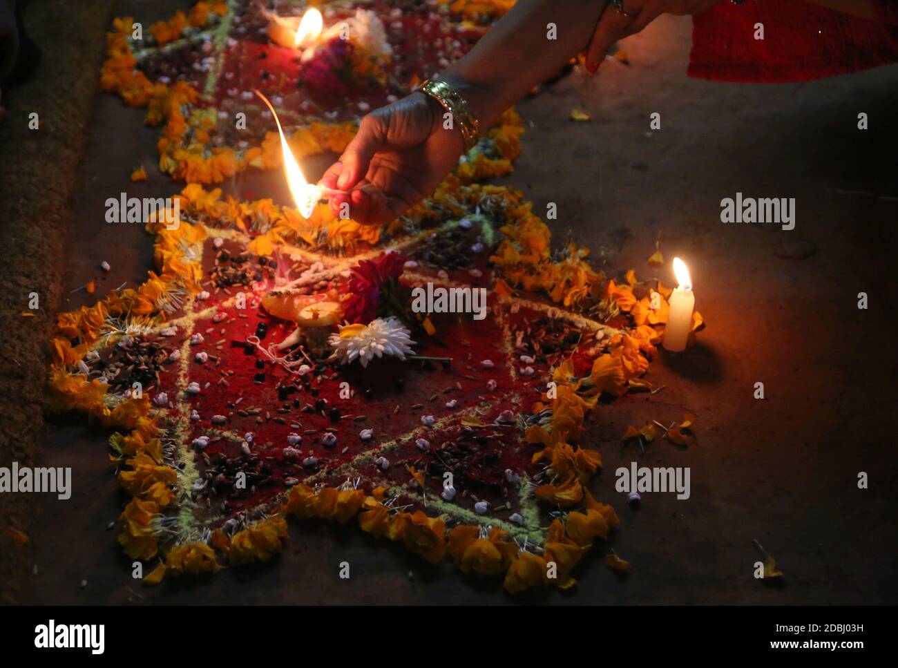 Kathmandu, Nepal. 17th Nov, 2020. A woman offers prayers to self ...
