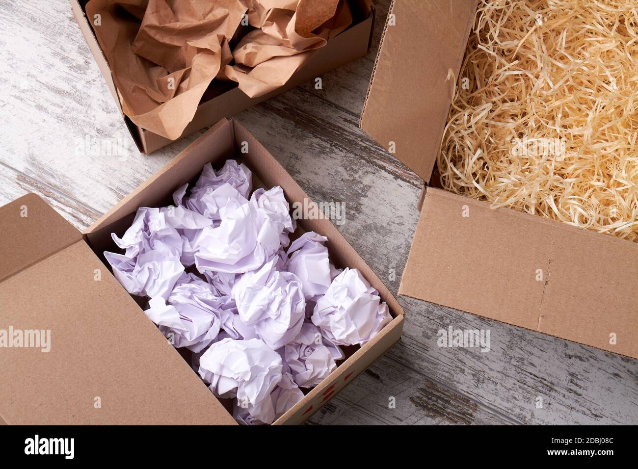 An open boxes with filling material inside Stock Photo Alamy