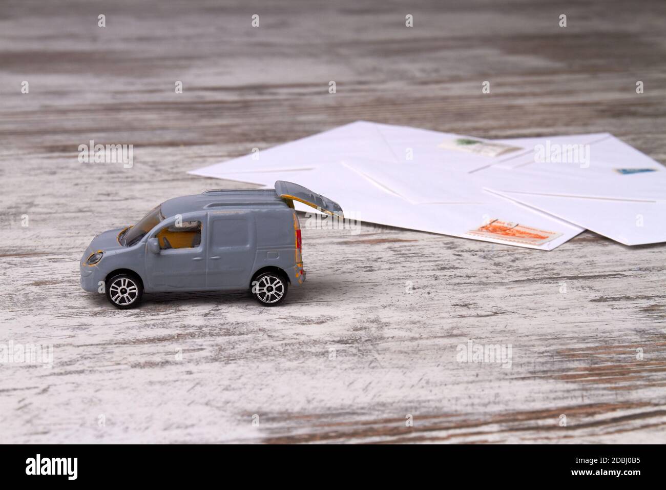 Toy delivery truck on retro wooden floor Stock Photo Alamy