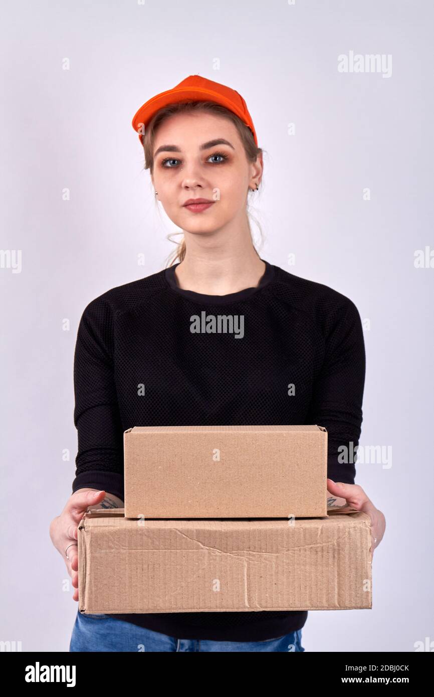 Young delivery box is holding parcels Stock Photo Alamy