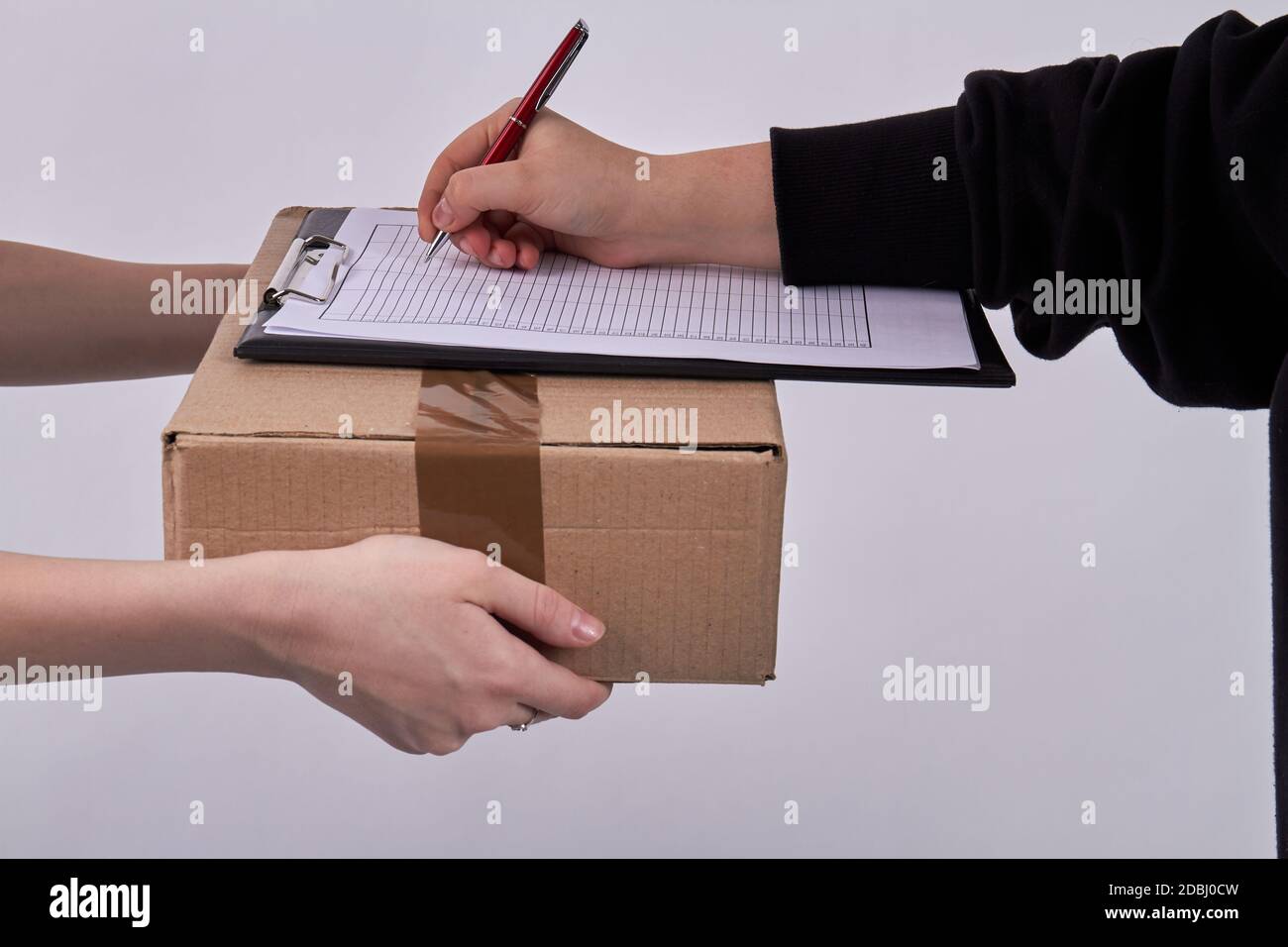 Customer signing receipt of delivery package Stock Photo Alamy