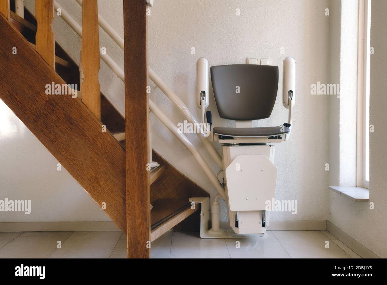 Automatic stairlift on staircase for elderly or disability in a house