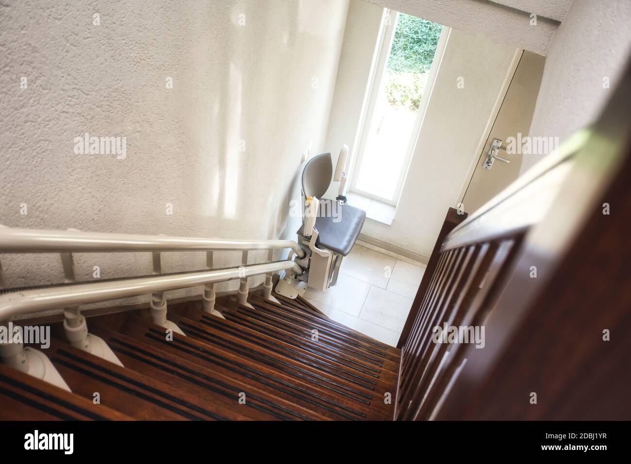 Automatic stairlift on staircase for elderly or disability in a house