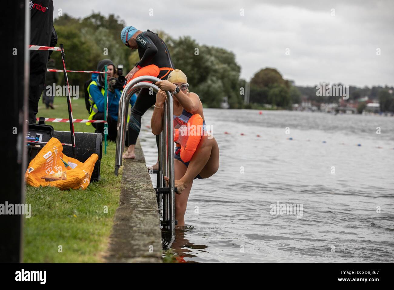 Swimmers take part in the annual Henley Swimming Festival where they swim in the River Thames in the ‘Henley Classic’ and varied lengths of miles. Stock Photo