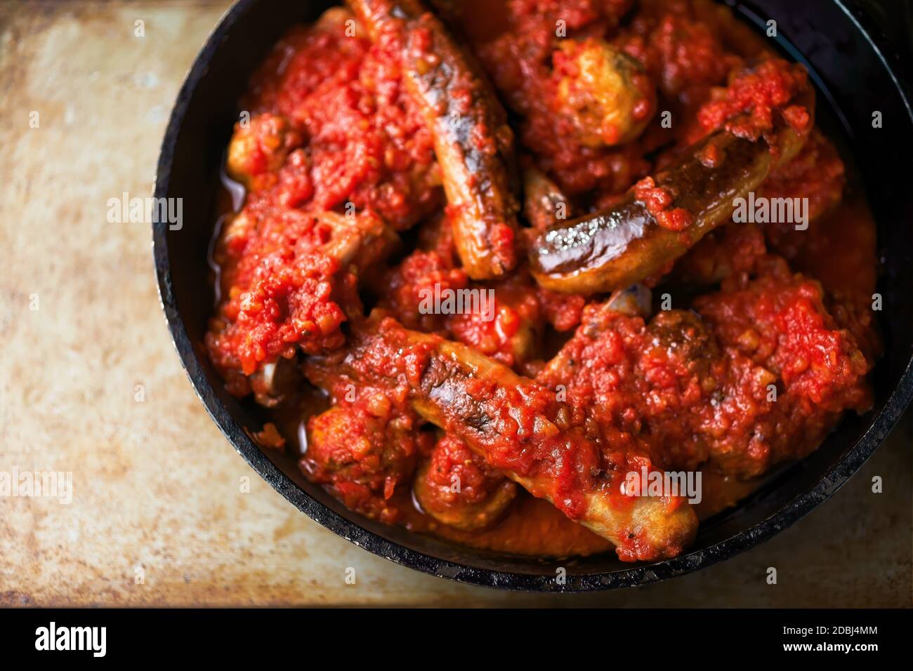 close up of traditional rustic italian sunday meat tomato sauce gravy Stock Photo
