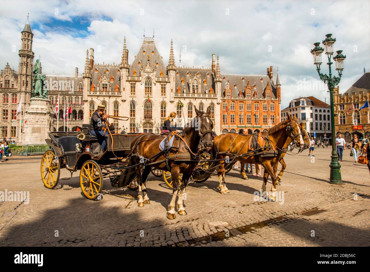 Horse drawn carriage in The Markt (Market Square), Bruges, UNESCO World Heritage Site, West Flanders, Belgium, Europe Stock Photo