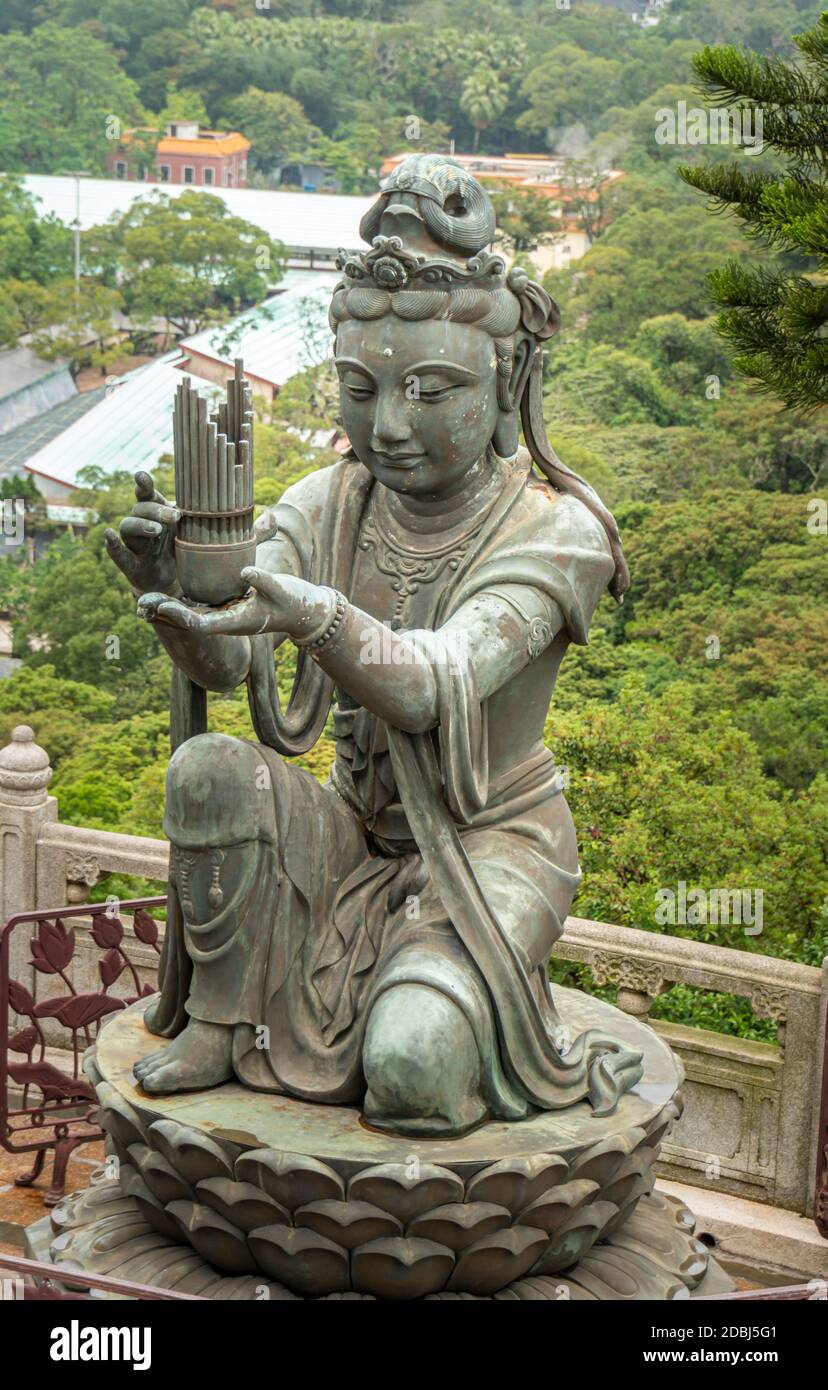 Buddhist Deva statue offering the gift of music to the Tian Tan Big Buddha  statue on Lantau Island, Hong Kong Stock Photo