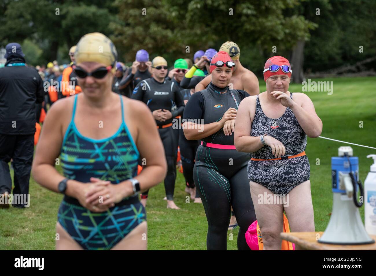 Swimmers take part in the annual Henley Swimming Festival where they swim in the River Thames in the ‘Henley Classic’ and varied lengths of miles. Stock Photo