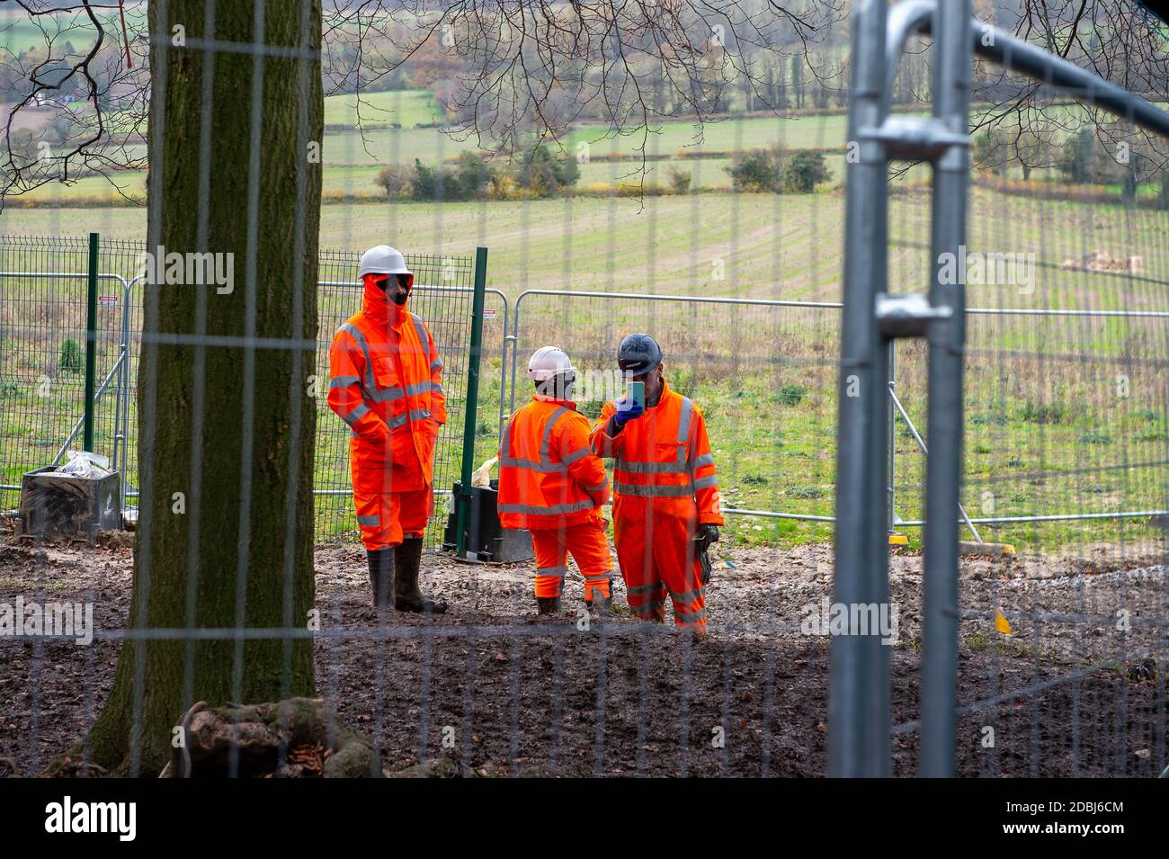Aylesbury Vale, Buckinghamshire, UK. 17th November, 2020. An HS2 worker films a member of the press taking photos. This is a regular feature of HS2's behaviour. The Woodland Trust have issued a press release asking for an immediate pause on work at the wood to said that they have “grave concerns” that ancient woodland due for imminent destruction by HS2 Ltd might be felled without proper survey work to identify bat roosts, and without the proper licences required by law. Credit: Maureen McLean/Alamy Live News Stock Photo