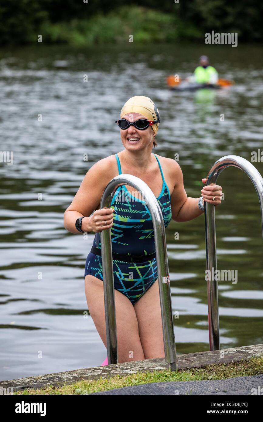 Swimmers take part in the annual Henley Swimming Festival where they swim in the River Thames in the ‘Henley Classic’ and varied lengths of miles. Stock Photo