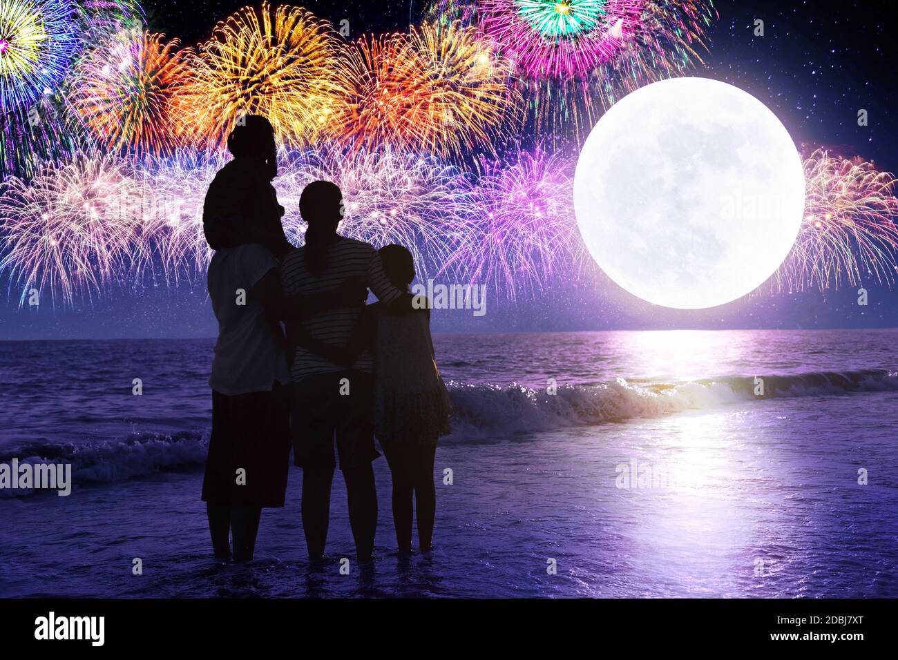 Happy family looking at holiday fireworks in sky Stock Photo - Alamy