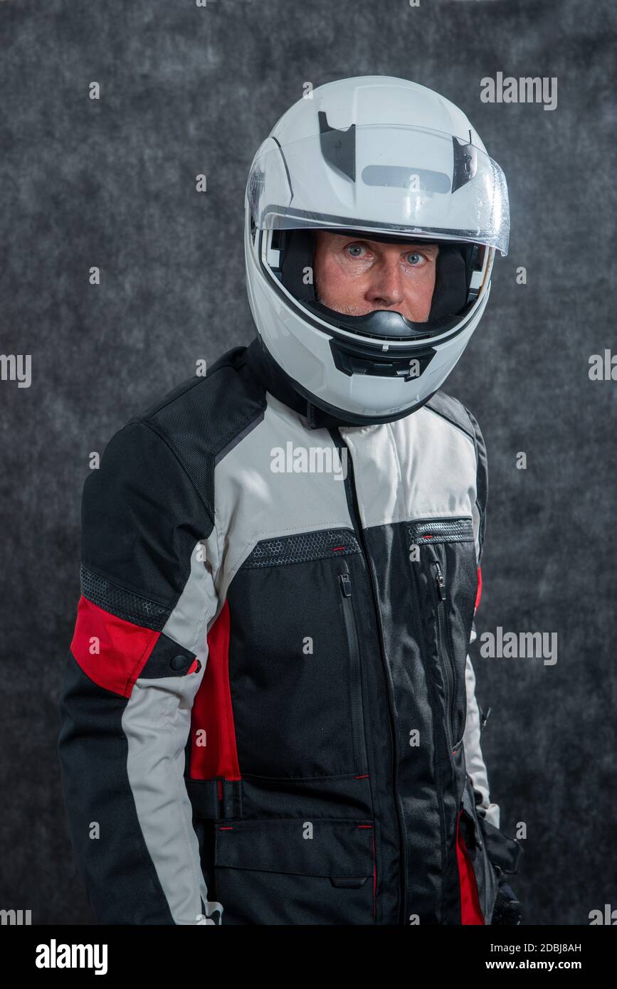 a portrait of senior biker with white helmet Stock Photo